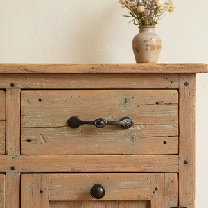 Rustic solid wood storage cabinet with vintage metal handles and weathered blue finish