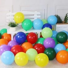 Vibrant assortment of colorful round daisy balloons for party decorations and events