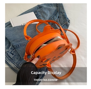 Interior view of pumpkin crossbody bag showing capacity for phone and essentials