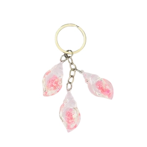 Dreamy luminous pink conch keychain with star sequins and golden metal ring