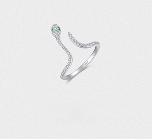 Close-up of S925 sterling silver snake ring with pavé crystals and green gemstone eyes
