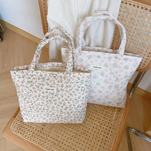 Floral quilted tote bags with simple wish labels on vintage rattan chair scenery