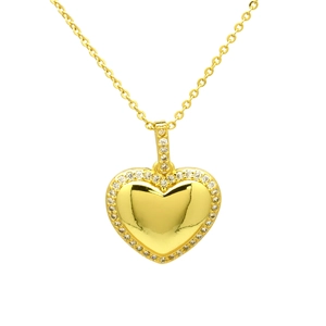 Macro detail of a gold heart pendant necklace with shimmering white zircon stones
