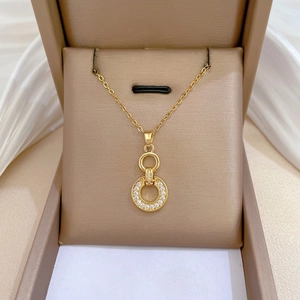 Elegant gold titanium interlocking ring necklace with crystal paved zircons in jewelry box