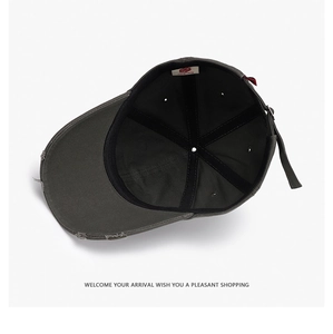 Detail view of cotton twill baseball cap interior with adjustable strap and branding label