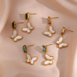 Detail of butterfly drop earrings with emerald green and aqua blue cubic zirconia