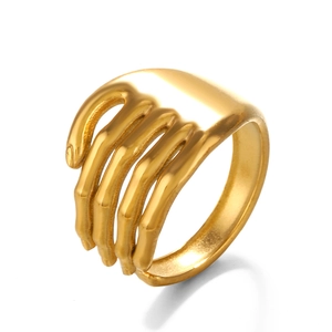 Minimalist gold-plated stainless steel ring with unique hand palm shape design on white background