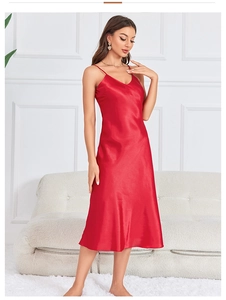 Detail view of the red satin V-neck nightgown showing luxurious silk-like fabric texture