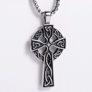 Detailed macro view of vintage gothic Celtic cross pendant with intricate knotwork