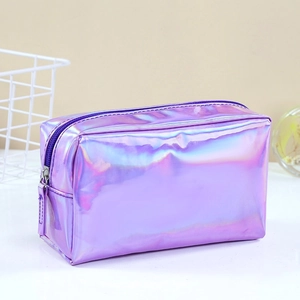 Sleek holographic purple makeup bag with shiny metallic finish on a white surface