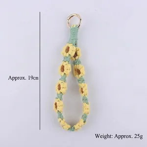 Handmade woven daisy lanyard with yellow flowers and mint green cord for keys or phones