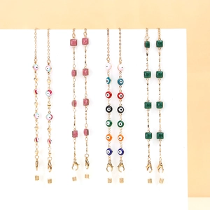 Elegant gold metal eyewear chain with crystal pearls and colorful evil eye beads