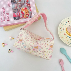 Detail of cute cream bubble fabric tote with pink bear prints and white lace shoulder straps