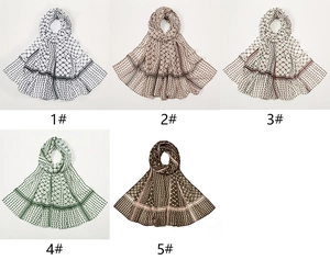 Detail showing five ethnic patterns of classic striped chiffon scarves with fringe edge