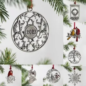 Vintage silver metal Christmas tree ornaments with snowmen and angels on festive branches