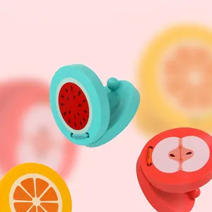 Wooden fruit castanets for kids featuring colorful watermelon and apple designs