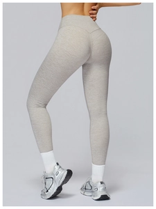 Close-up of high-waisted yoga pants with brushed marl grey texture and slim fit design