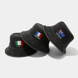 Foldable washed denim bucket hats with vintage country flag embroidery on white background