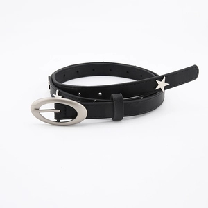 Detail of black faux leather belt featuring silver star studs and oval alloy buckle