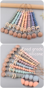Detail of wooden clip and Morandi silicone beads on food grade baby pacifier chain