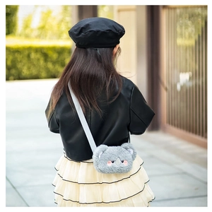 Detail view of a cute grey plush koala crossbody bag for kids with soft fur and adjustable strap