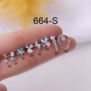 Detailed macro view of silver titanium steel cartilage studs with various zircon shapes