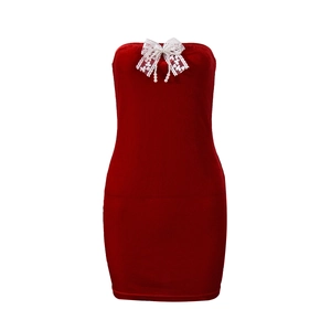 Detailed close-up of red velvet bodycon dress featuring white lace bow and pearl pendant