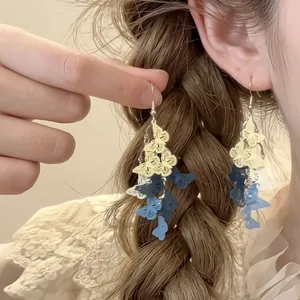Elegant multi-layered butterfly drop earrings in blue and yellow gold plated finish