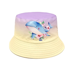 Close-up of bucket hat showing blue whale watercolor print and fine brim stitching