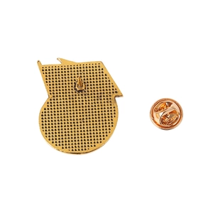 Golden Soviet rocket star medal brooch back detail with butterfly clutch and textured finish