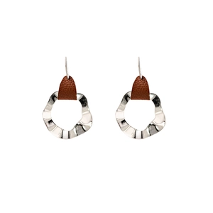 Detail of bohemian geometric round earrings with silver wavy metal and brown accents