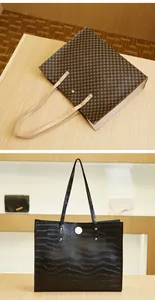 Detail of two large tote bags featuring brown geometric prints and black crocodile texture
