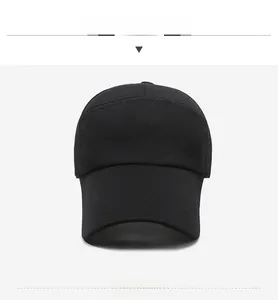 Detail of black mesh baseball cap showing long brim stitching and silver shield logo