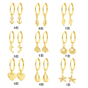 Golden S925 silver ocean-themed hoop earrings featuring shells, starfish and dolphins