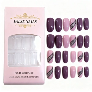 Deep purple and pink press-on nail set with black lines and glitter details in box