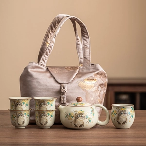 Ru-kiln ceramic tea set with cat patterns, including teapot, cups, and a fabric bag