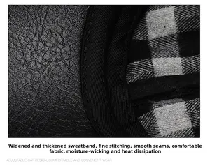 Close-up of black faux leather cap with thick sweatband and checkered lining detail