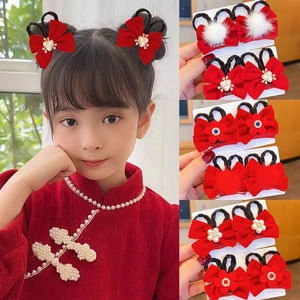 Red bow hair clips for girls featuring festive Chinese New Year style and synthetic pearls