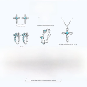 Macro view of S925 silver turquoise cross stud earrings and jewelry set details