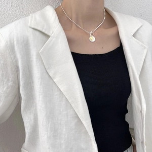 Minimalist 925 sterling silver necklace with double round smiley face pendants on model