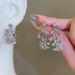 Elegant silver necklace and earrings set with purple leaf-shaped cubic zirconia stones