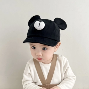 Close-up of baby baseball cap featuring cute 3D bear ears and animal facial detail