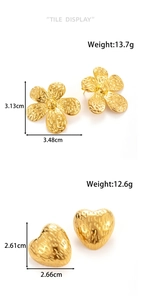Detailed view of gold stainless steel flower and heart earrings with wavy hammered texture