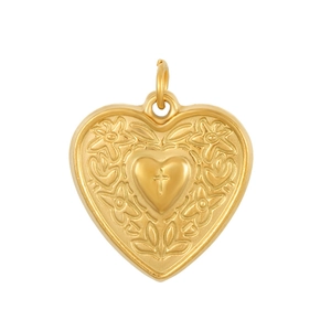 Golden heart pendant with embossed floral patterns and cross detail on white background