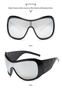 Detail of oversized Y2K shield sunglasses with black frames and silver mirror lenses