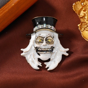 Halloween skeleton skull brooch in black high hat with rhinestones on dark silk background