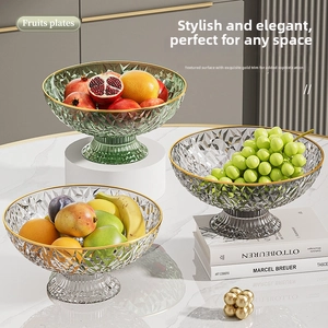 Close-up of elegant footed fruit bowl featuring diamond-cut patterns and golden rim details
