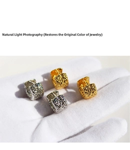 Detailed close-up showing the metallic lava texture and wrinkled pattern on square earrings