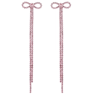 Detail of pink rhinestone bow earrings with long tassel dangles for elegant bridal wear