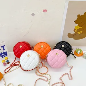 Quilted round crossbody mini bags with gold flower accents in five vibrant colors